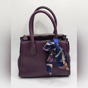 Burgundy Aldo small hand bag.